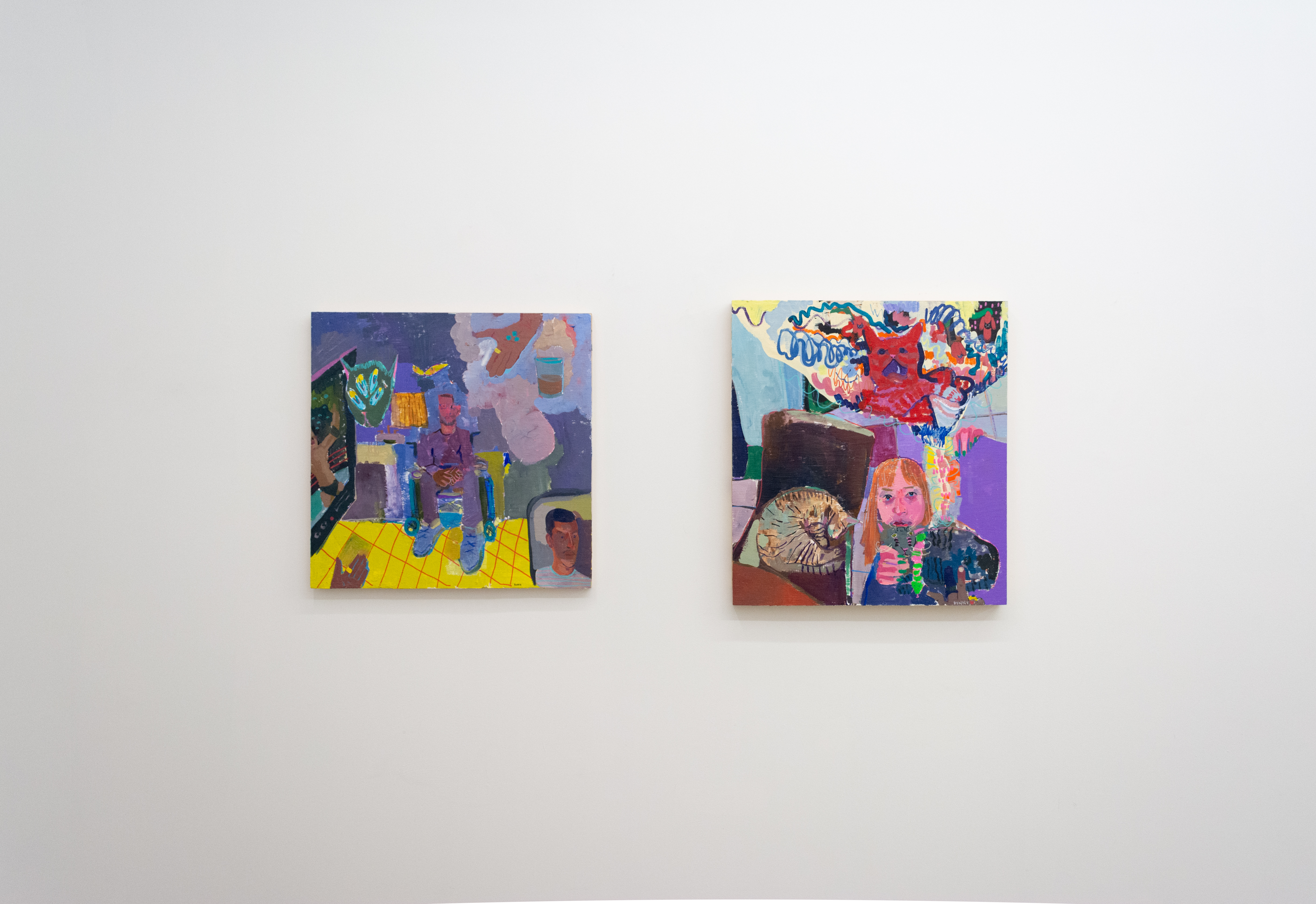 Two paintings by Jason Correia installed on a gallery wall